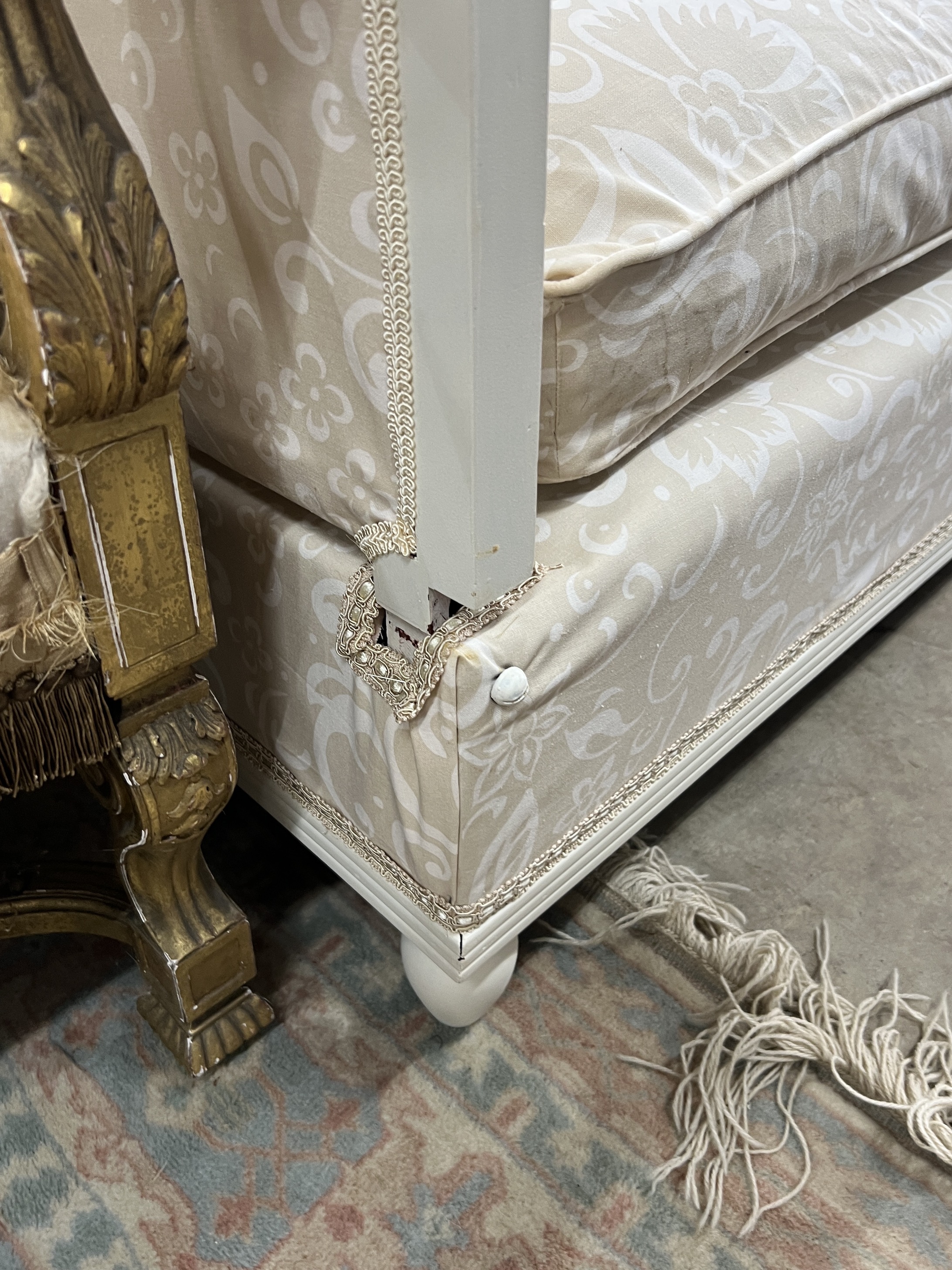 A French cream painted upholstered folding day bed, length 135cm, depth 68cm, height 77cm